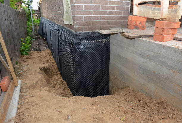 Happy homeowners after waterproofing job in Riceville